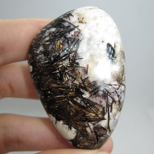 Astrophyllite and natrolite pebble